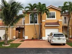 a car parked in front of a house