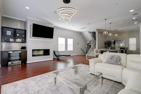 a living room with fireplace furniture and a flat screen tv