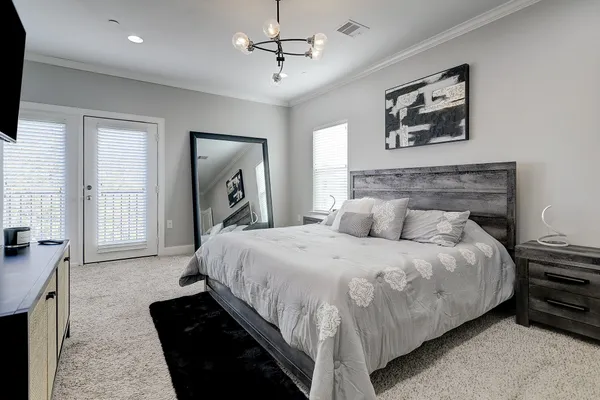 a bedroom with bed and window