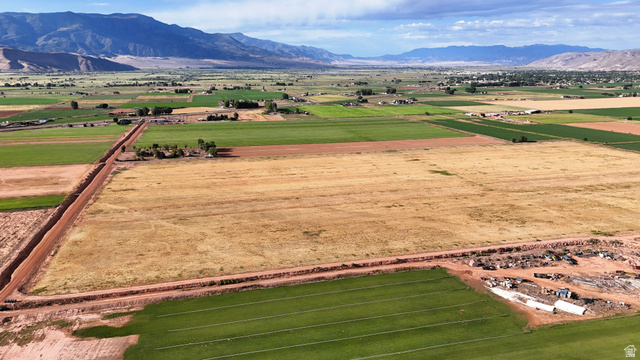 2070 East Tbd Road North Richfield, UT 84701 - Photo 6 of 35 Expansive agricultural acreage featuring cultivated fields and undeveloped land with distant mountains