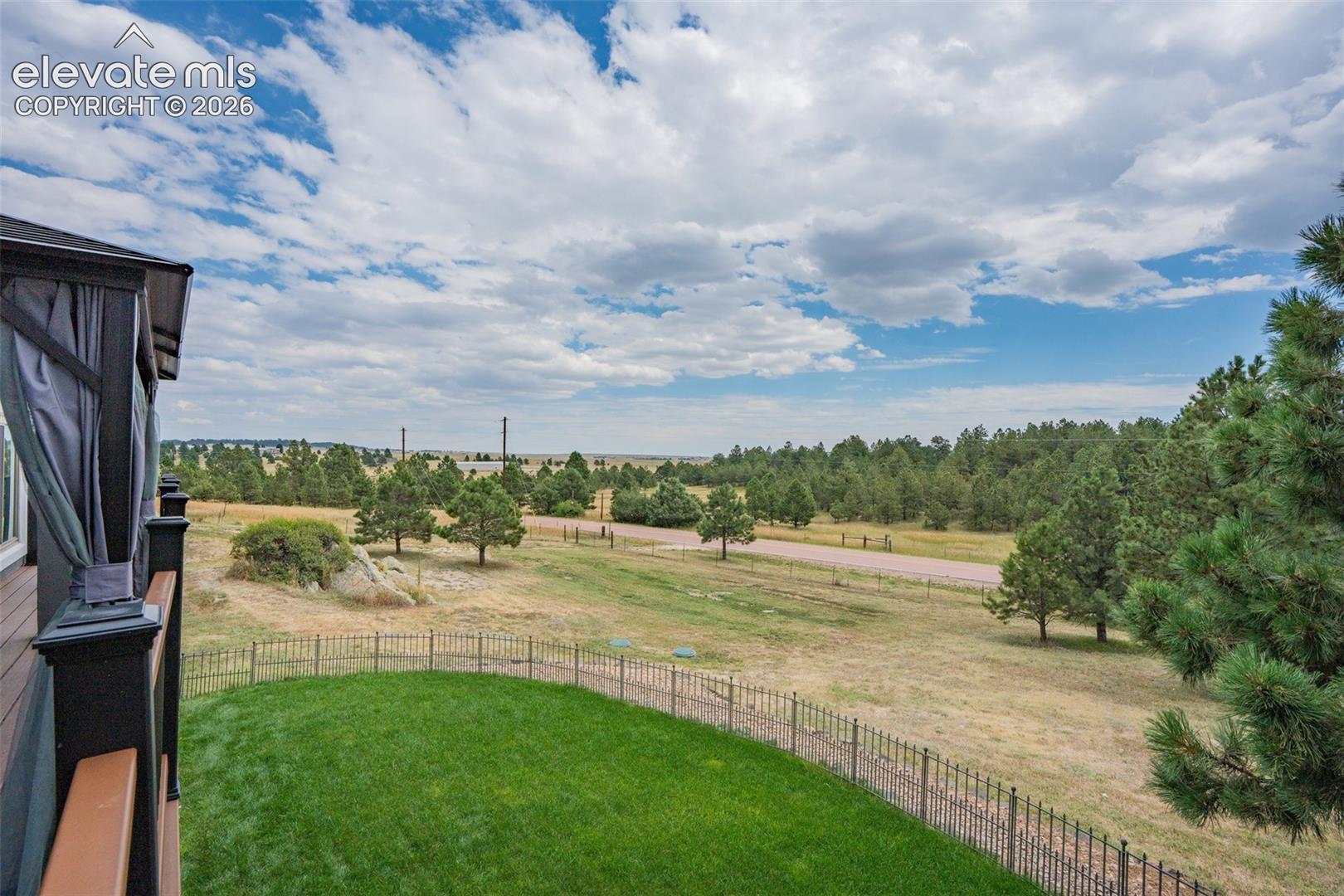 17370 Sweet Road Peyton, CO 80831 - Photo 13 of 47 Beautiful front yard is fenced separately, this is the view from the front deck.