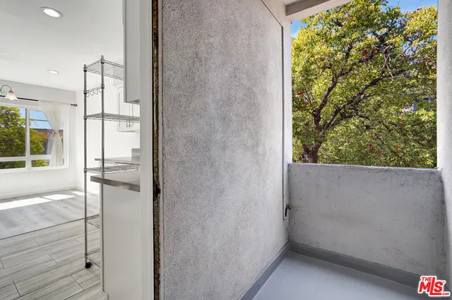 a view of a bathroom with a tub and shower