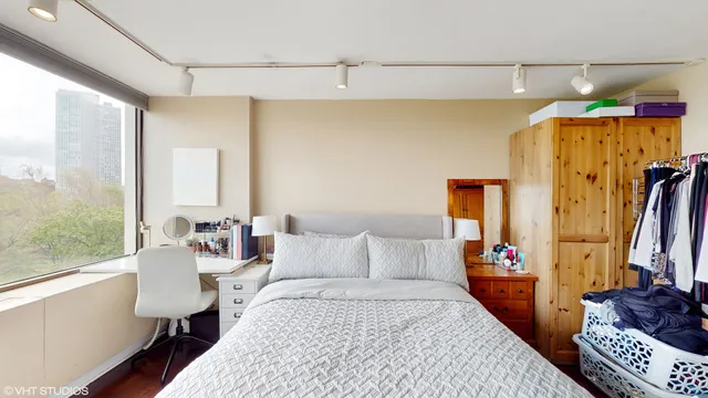 a bedroom with a bed and a walk in closet