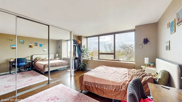 a bedroom with a bed and a closet