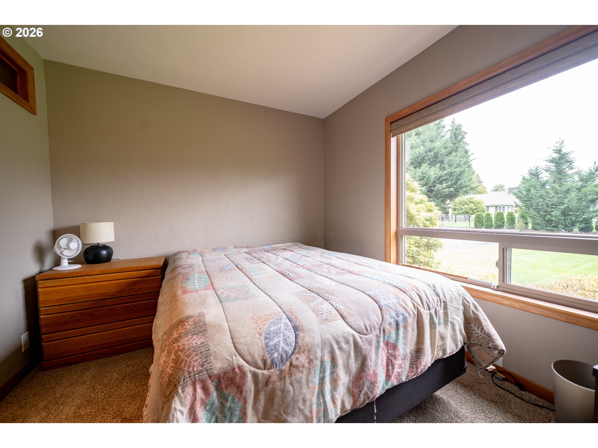 455 West High Street Stayton, OR 97383 - Photo 22 of 48 a bedroom with a bed and a large window