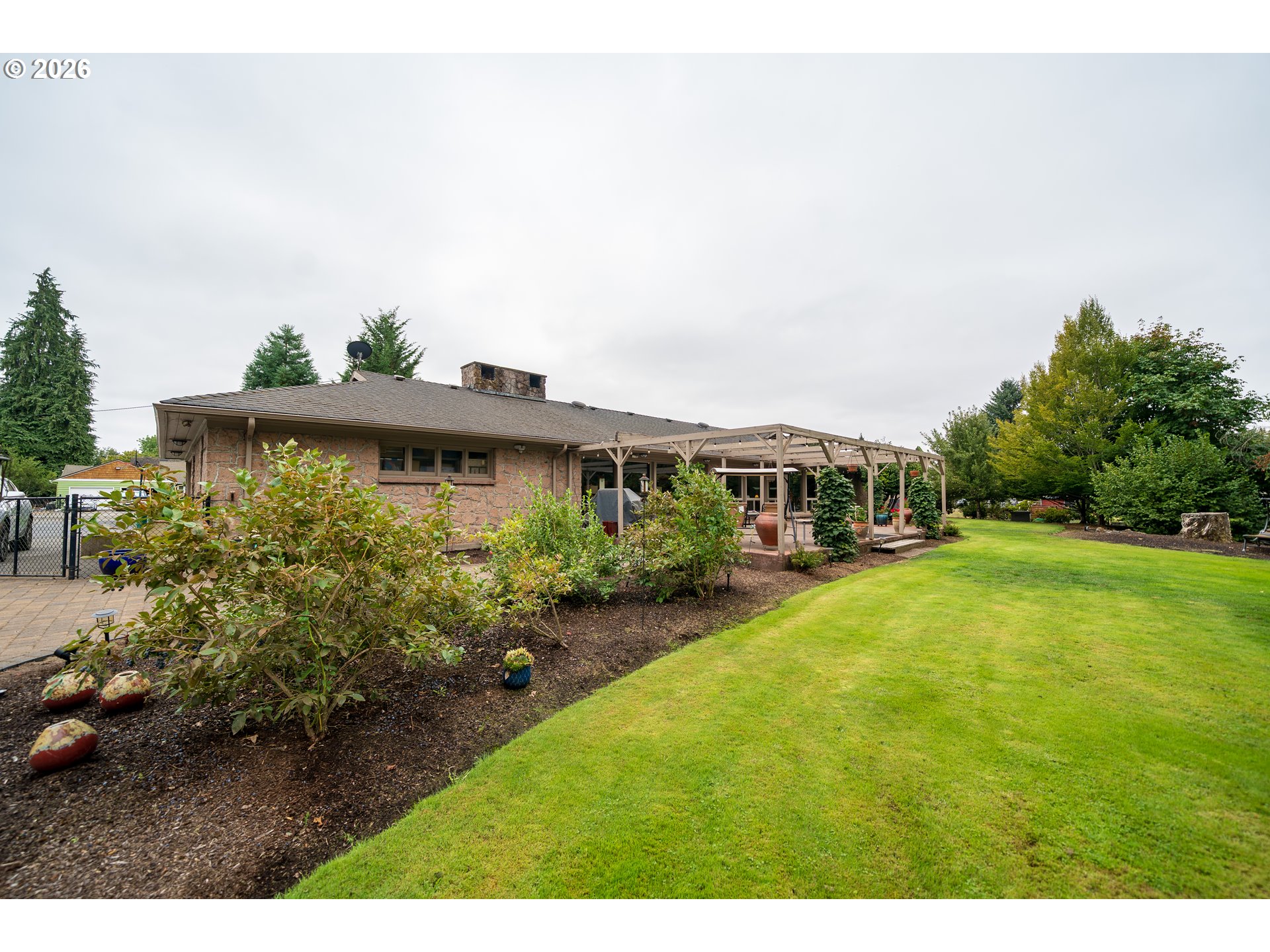 455 West High Street Stayton, OR 97383 - Photo 27 of 48 a view of a house with a yard