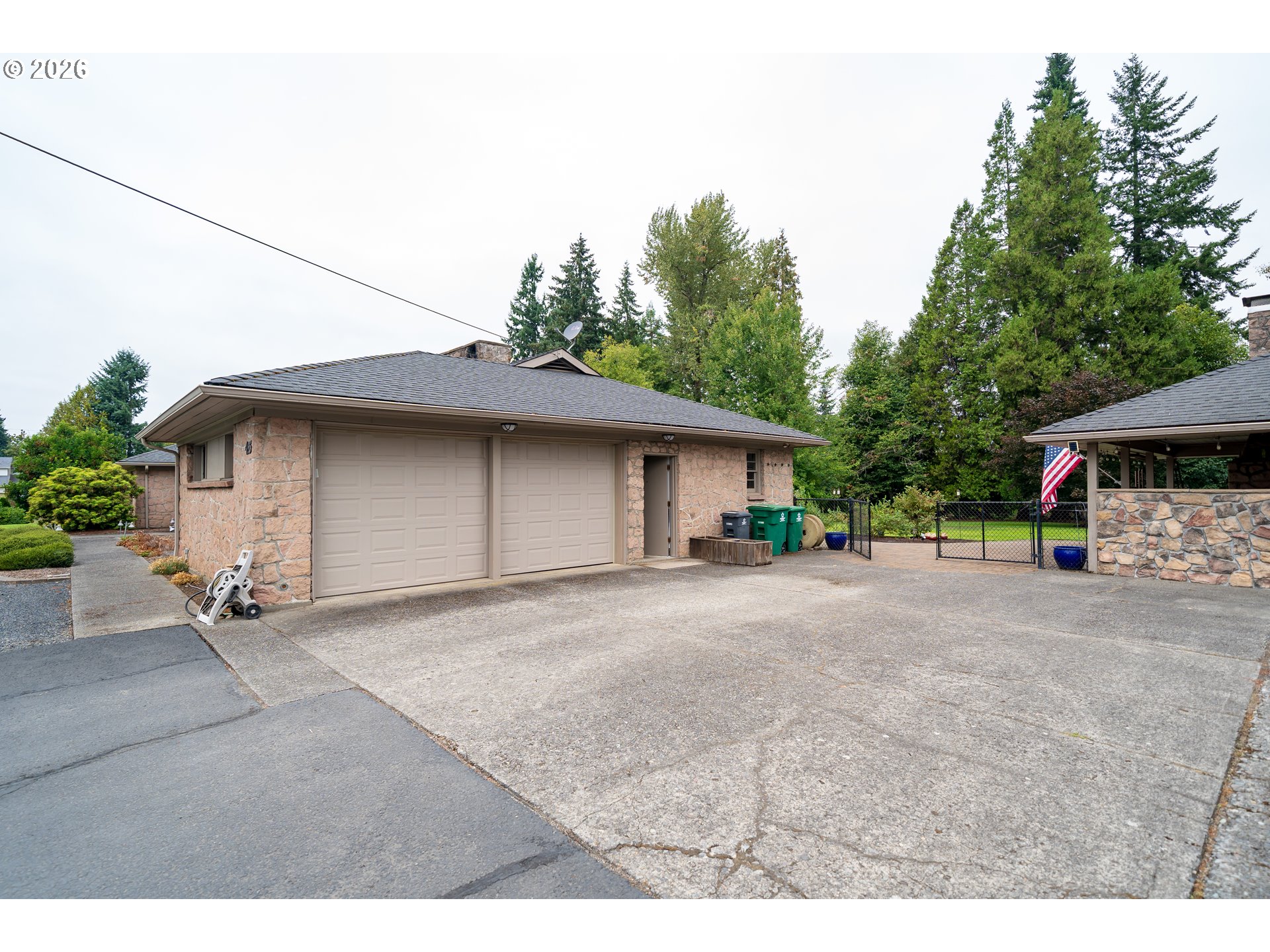 455 West High Street Stayton, OR 97383 - Photo 36 of 48 a view of a house with a patio and a yard