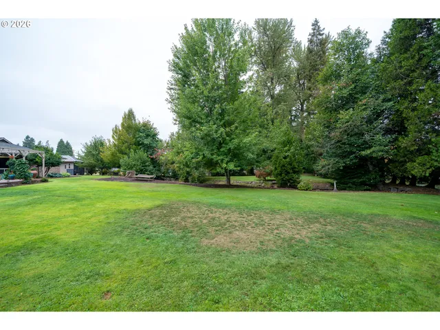 a view of a lake with a yard