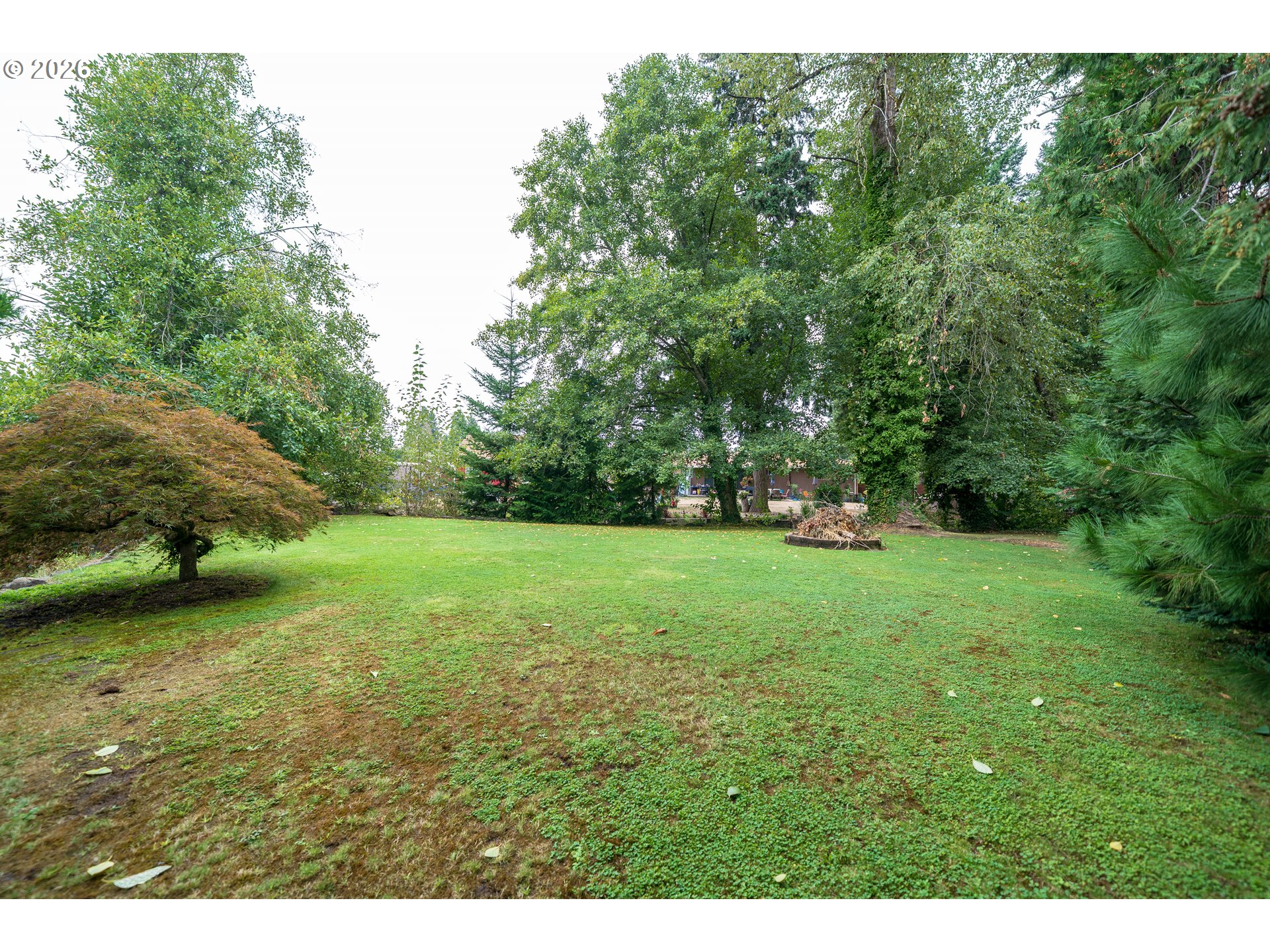 455 West High Street Stayton, OR 97383 - Photo 43 of 48 a view of a field of grass and trees