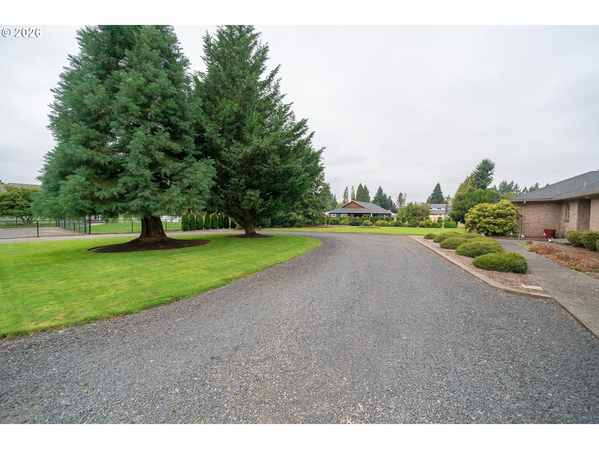 455 West High Street Stayton, OR 97383 - Photo 46 of 48 a view of a park with large trees