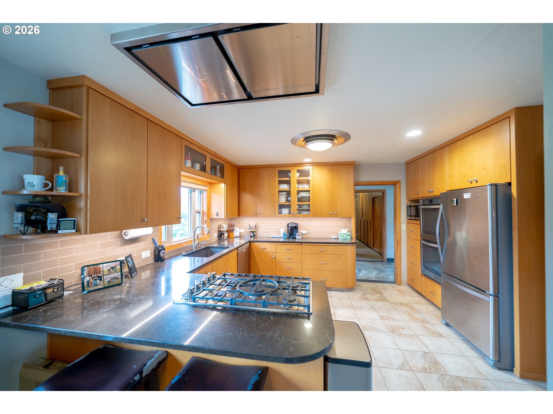 455 West High Street Stayton, OR 97383 - Photo 8 of 48 a large kitchen with stainless steel appliances granite countertop a sink refrigerator and microwave