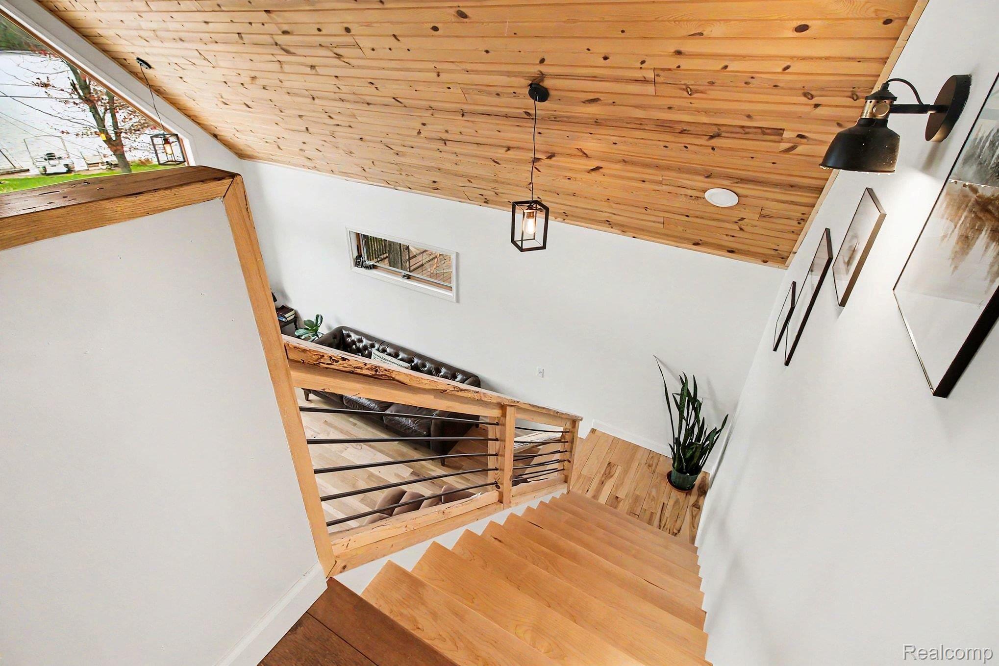 4375 Skinner Lake Road Lapeer, MI 48446 - Photo 12 of 30 Stairs with wood ceiling and wood finished floors