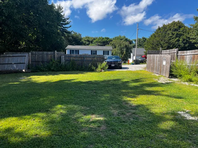 a swimming pool with wooden fence