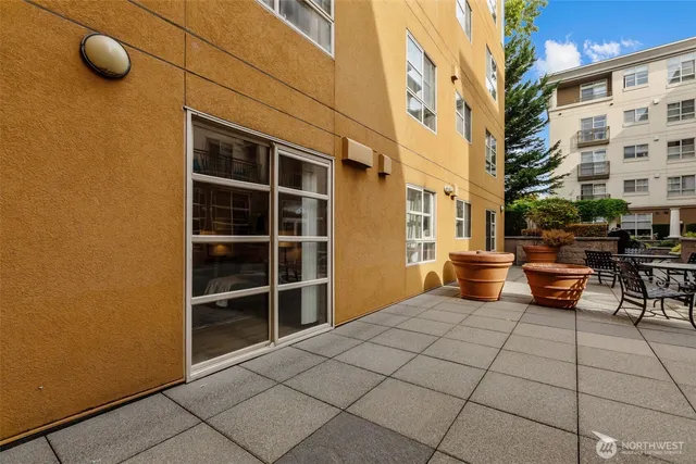 a view of an empty room with many windows