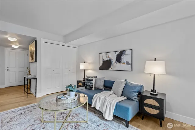 a living room with furniture and a lamp