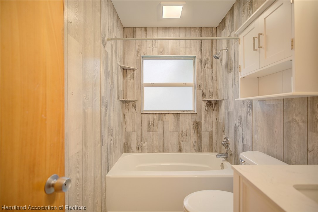 114 Spring Garden Road Sebring, FL 33870 - Photo 13 of 34 a bathroom with a shower curtain and a sink