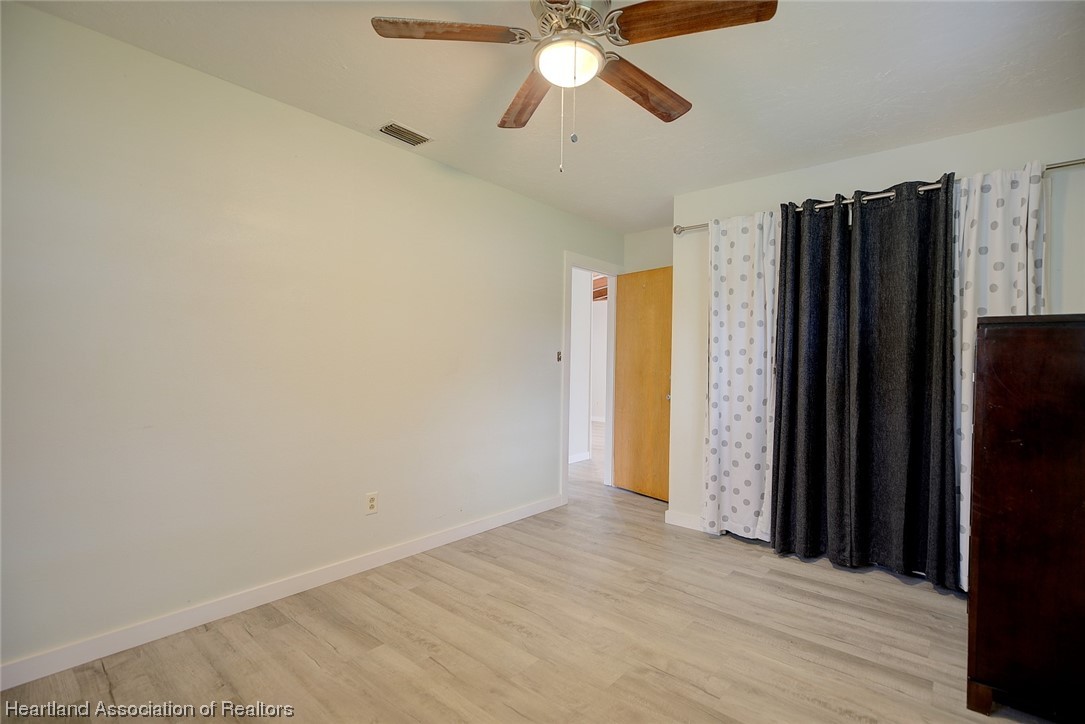 114 Spring Garden Road Sebring, FL 33870 - Photo 16 of 34 a view of a hallway with a empty space and a window
