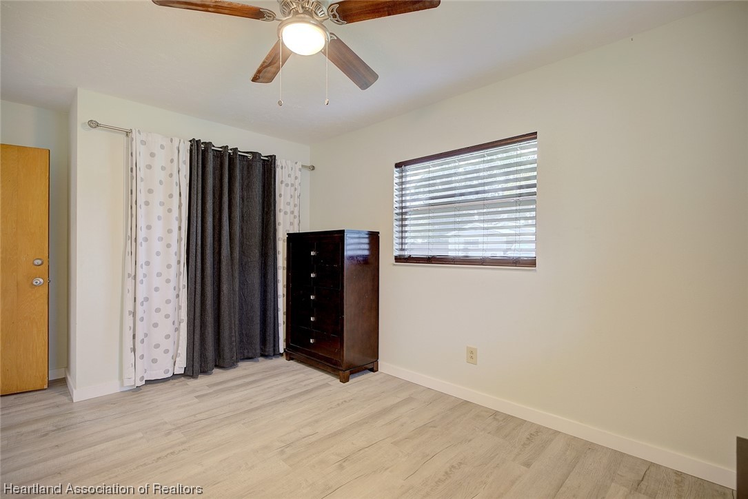 114 Spring Garden Road Sebring, FL 33870 - Photo 17 of 34 a view of an empty room with a window