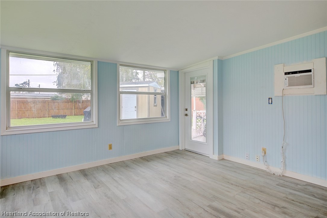 114 Spring Garden Road Sebring, FL 33870 - Photo 18 of 34 a view of an empty room with a window