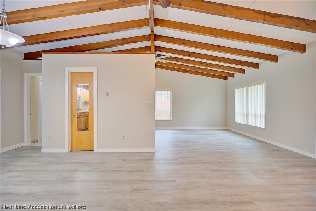 114 Spring Garden Road Sebring, FL 33870 - Photo 24 of 34 a view of a room with wooden floor and a ceiling fan