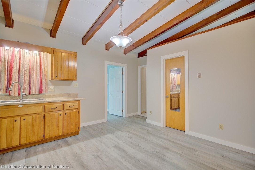114 Spring Garden Road Sebring, FL 33870 - Photo 26 of 34 a view of a kitchen with a sink and wooden floor