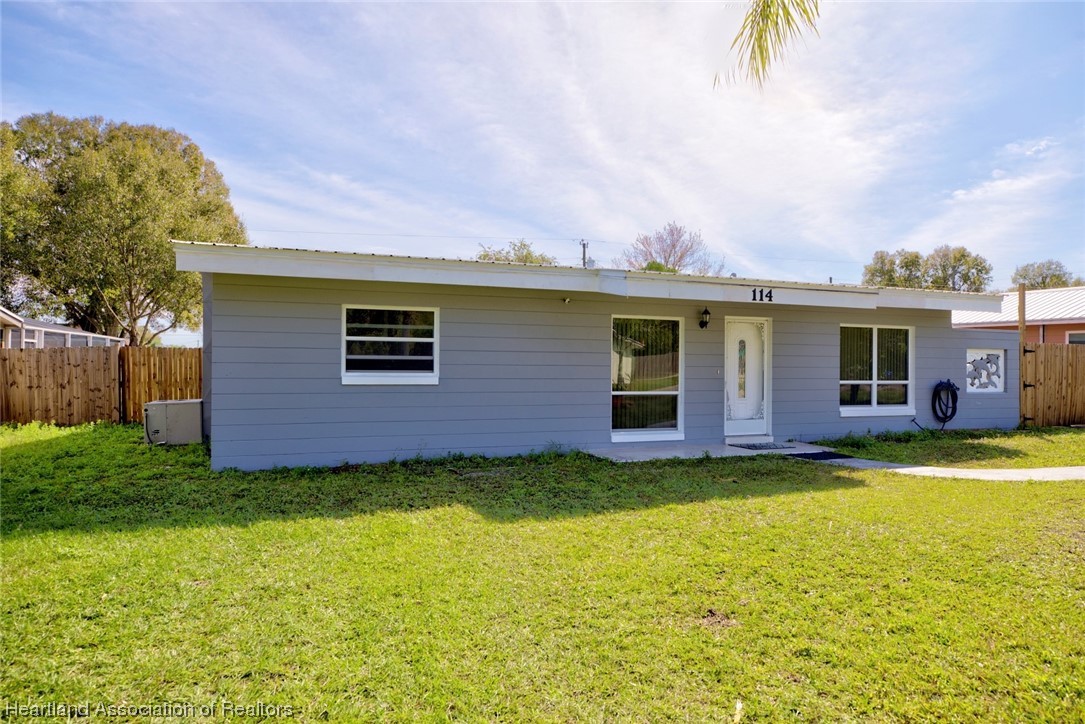 114 Spring Garden Road Sebring, FL 33870 - Photo 5 of 34 a view of a house with a yard