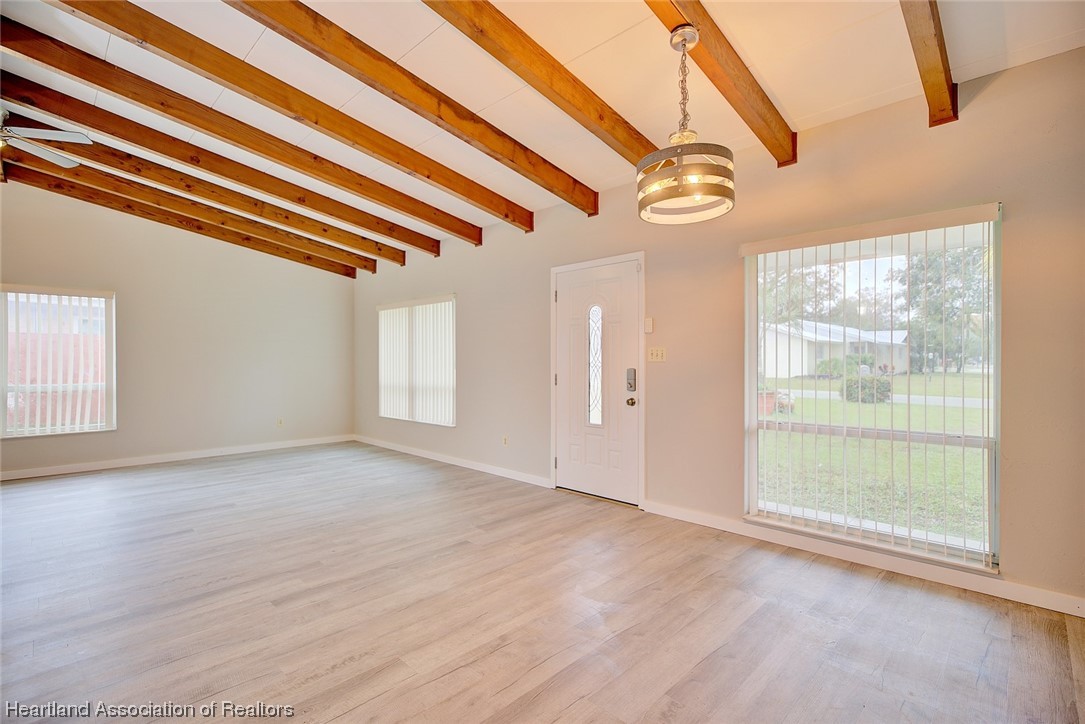 114 Spring Garden Road Sebring, FL 33870 - Photo 9 of 34 a view of empty room with wooden floor and fan