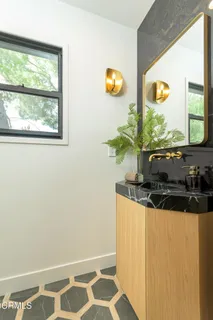 a kitchen with stainless steel appliances granite countertop a sink and a granite counter tops