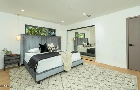 a bedroom with a bed and a walk in closet