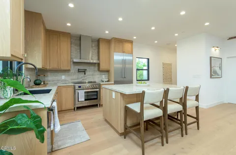 a kitchen with a sink cabinets and window