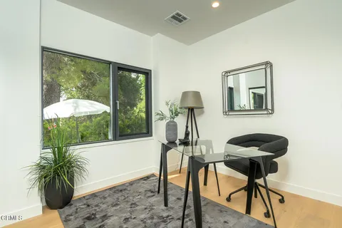 a view of a livingroom with furniture and front door