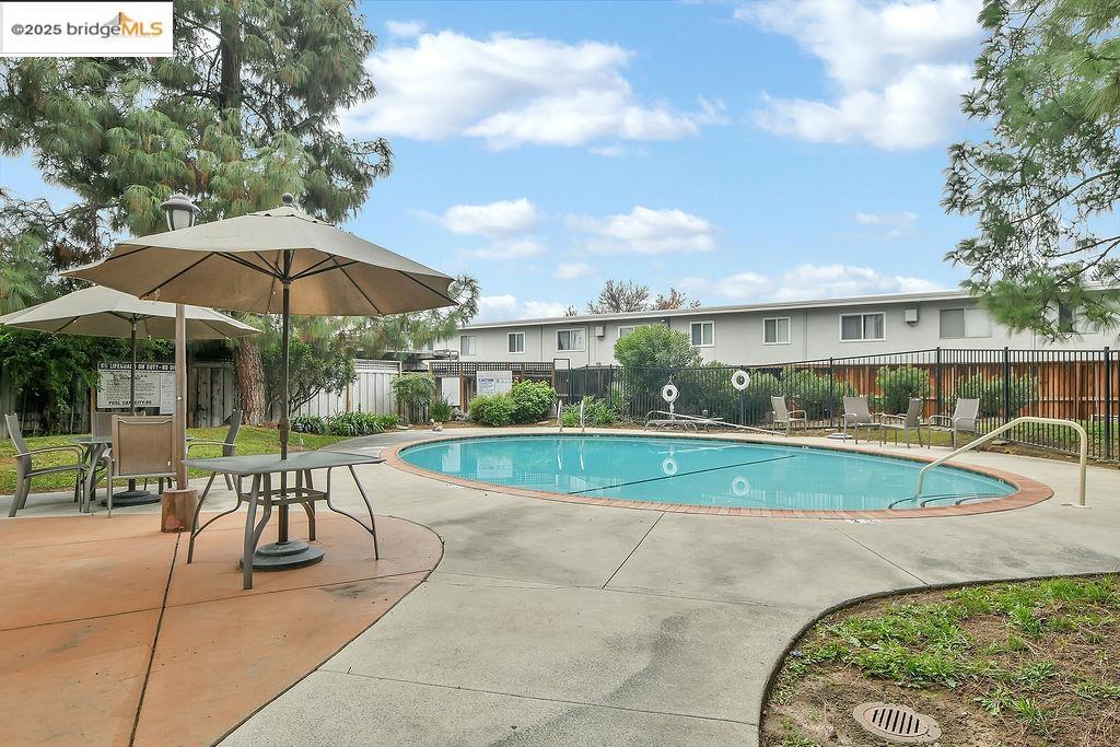 1699 Laguna Street, Unit 311 Concord, CA 94520 - Photo 24 of 29 a view of a swimming pool with a patio