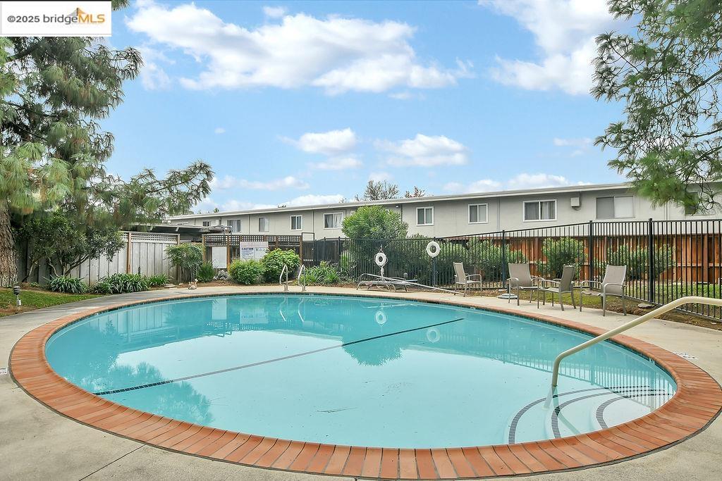 1699 Laguna Street, Unit 311 Concord, CA 94520 - Photo 25 of 29 a view of a house with swimming pool and sitting area