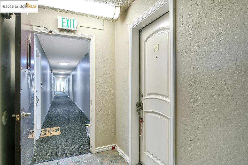 1699 Laguna Street, Unit 311 Concord, CA 94520 - Photo 6 of 29 a view of a hallway with entryway and livingroom