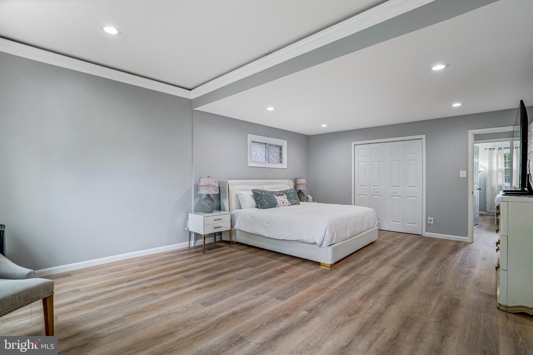 7727 Kalorama Road Annandale, VA 22003 - Photo 11 of 51 Spacious, serene bedroom with modern elegance.
