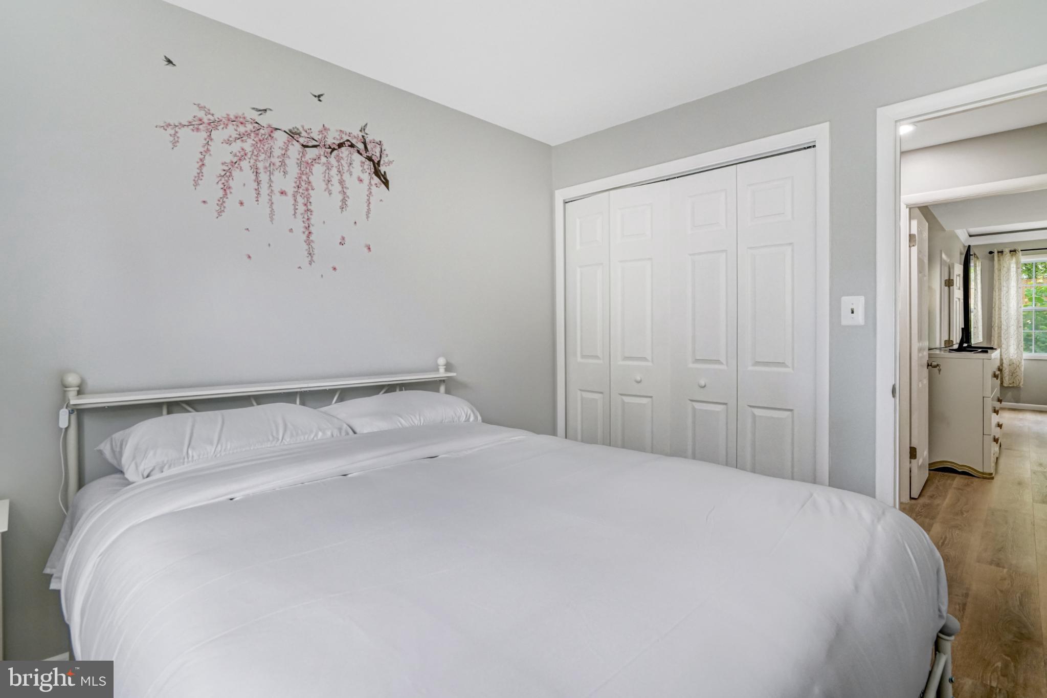 7727 Kalorama Road Annandale, VA 22003 - Photo 16 of 51 Serene bedroom with floral wall art.