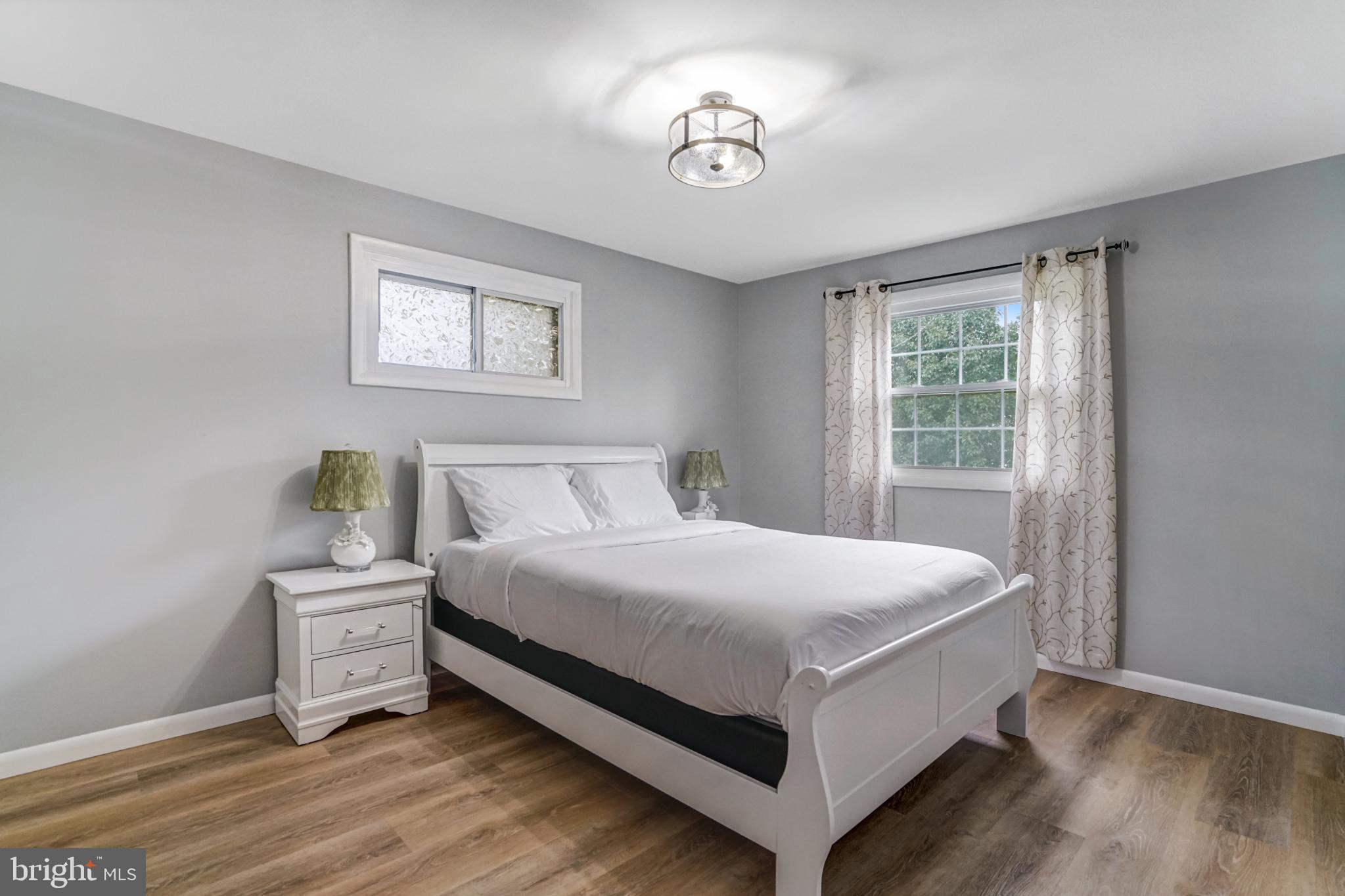 7727 Kalorama Road Annandale, VA 22003 - Photo 17 of 51 Serene bedroom with natural light and charm.