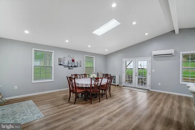 a view of a dining room with furniture and window