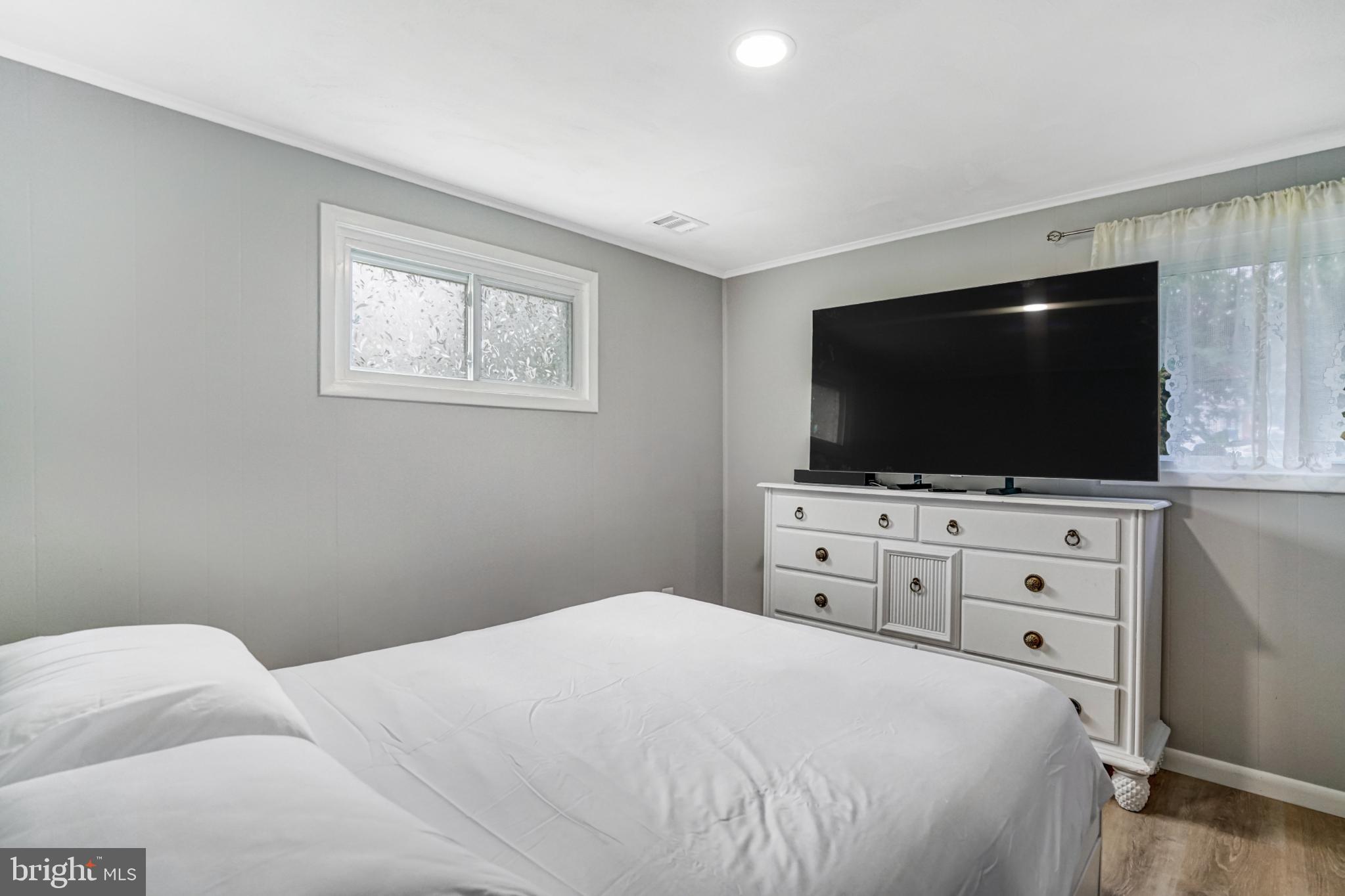 7727 Kalorama Road Annandale, VA 22003 - Photo 41 of 51 Cozy bedroom with natural light and modern decor.