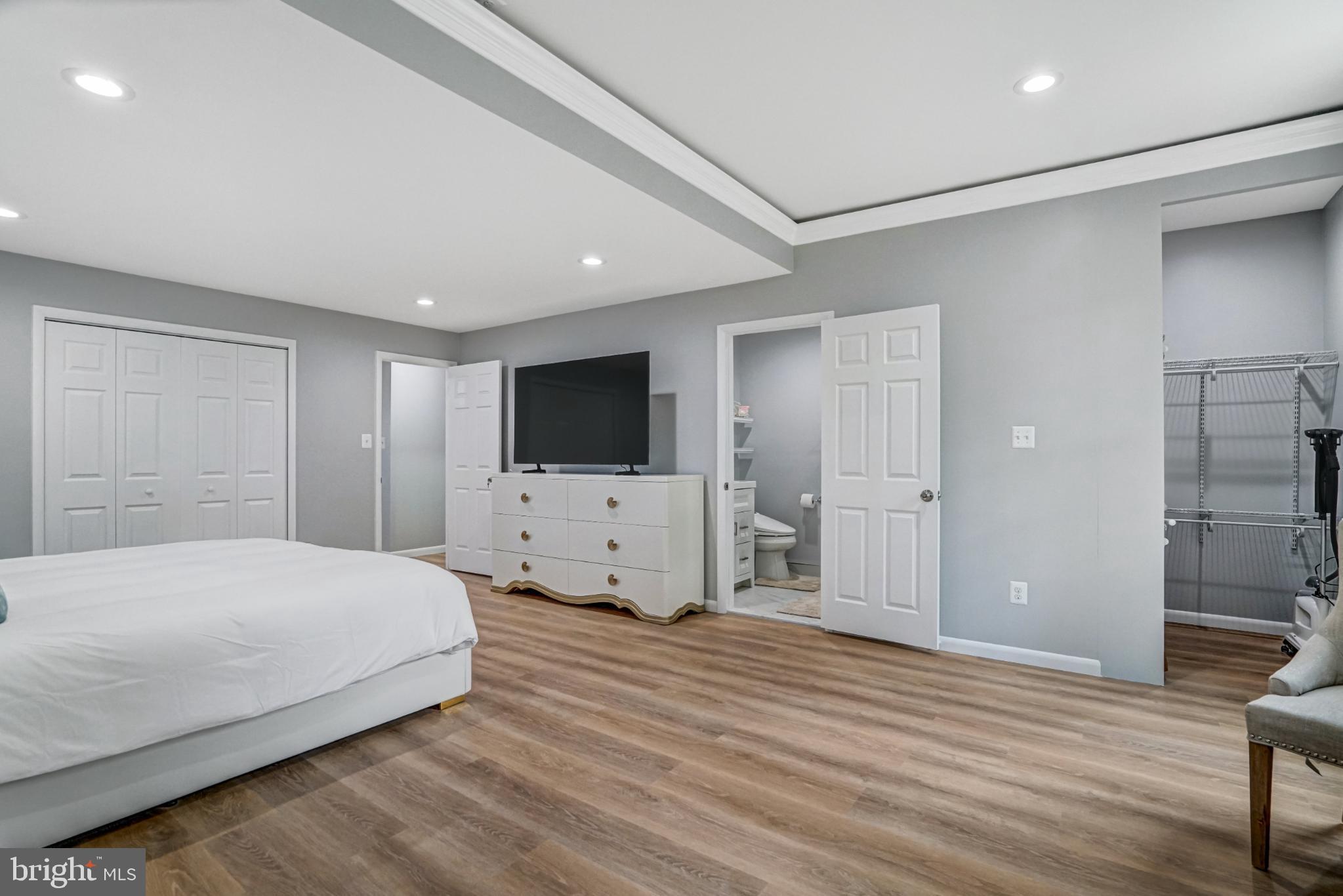 7727 Kalorama Road Annandale, VA 22003 - Photo 50 of 51 Spacious modern bedroom with serene tones.