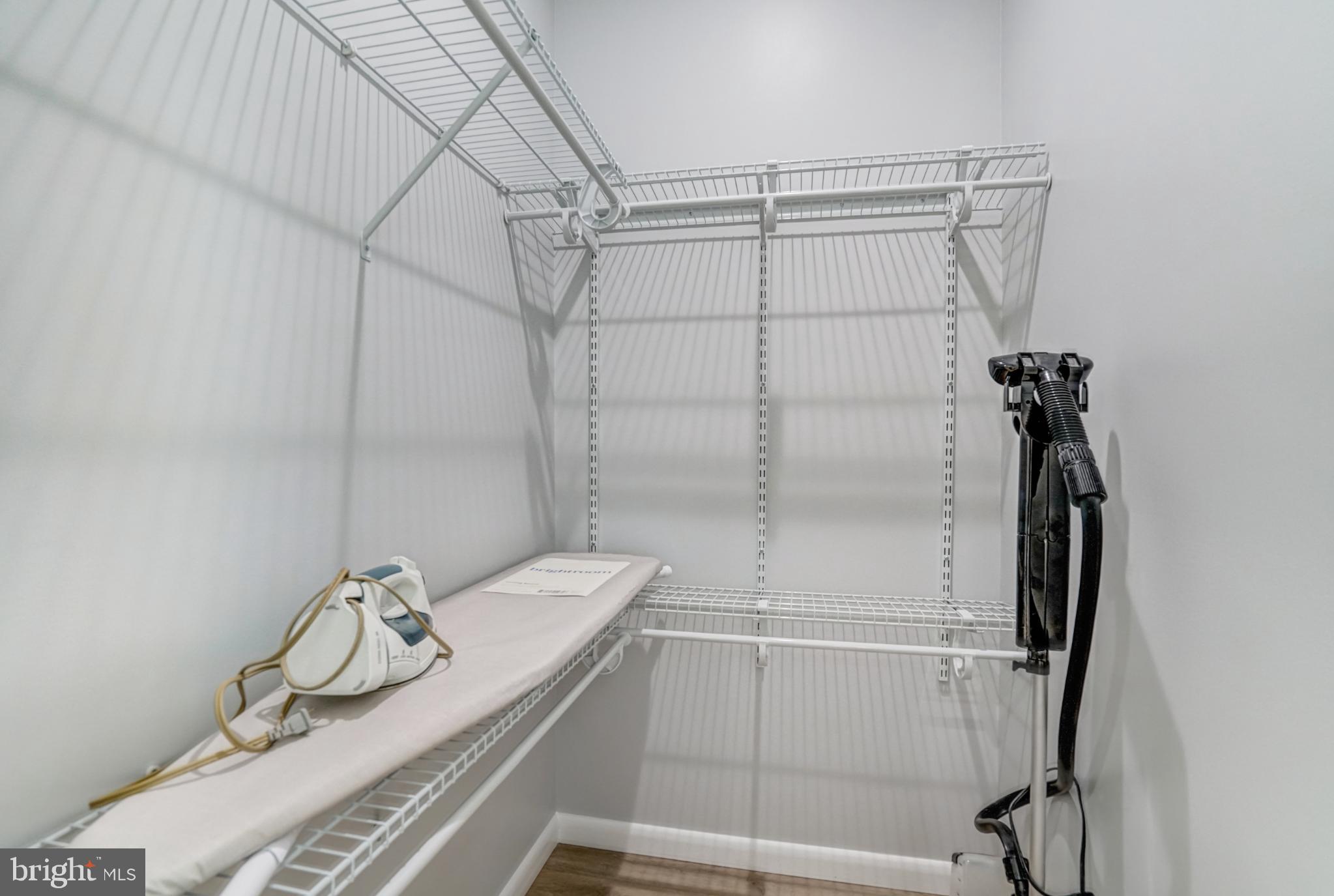 7727 Kalorama Road Annandale, VA 22003 - Photo 51 of 51 Spacious closet with organized shelving.