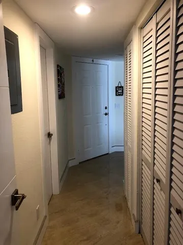 a view of a hallway with a bathroom