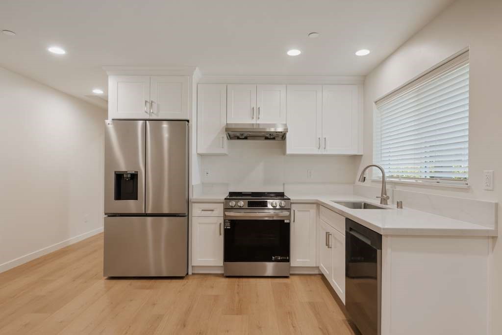 1806 South 8th Street, Unit B Alhambra, CA 91803 - Photo 19 of 44 a kitchen with a sink and a refrigerator