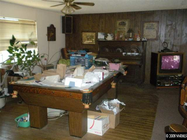 10066 Bauxite Court Reno, NV 89506 - Photo 3 of 5 a dining room with furniture and a fireplace