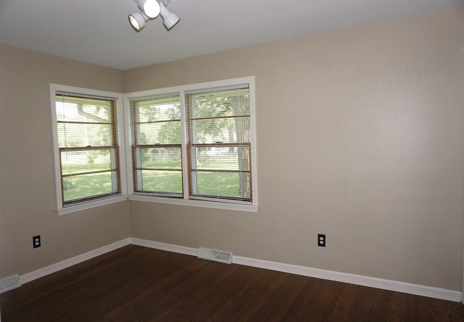10420 Clark Road Crown Point, IN 46307 - Photo 8 of 9 an empty room with wooden floor and windows