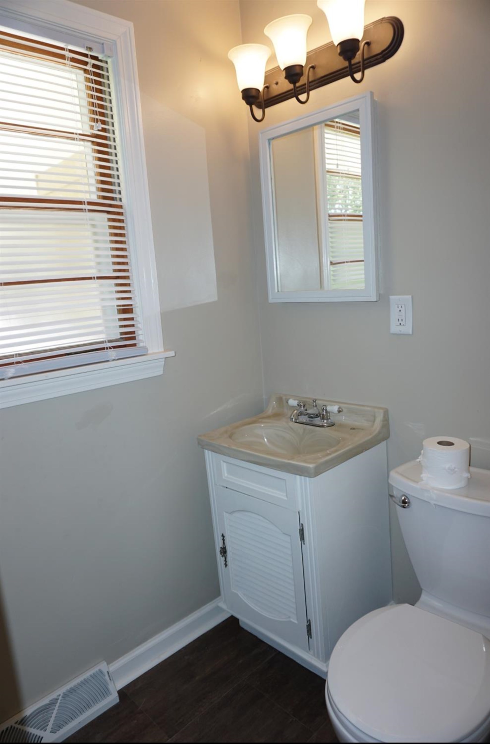 10420 Clark Road Crown Point, IN 46307 - Photo 9 of 9 a bathroom with a granite countertop toilet sink and mirror