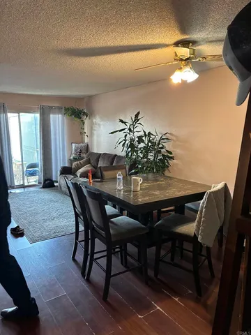 a view of a dining room with furniture and window