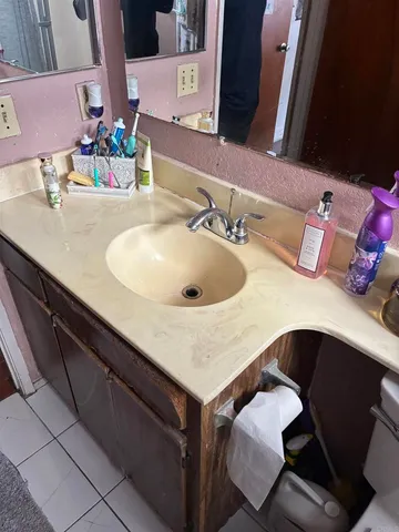 a bathroom with a sink and a mirror