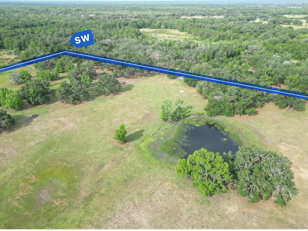 772b Webster Webster, FL 33597 - Photo 11 of 44 a view of a lake from a balcony