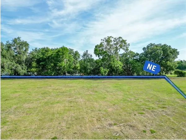 a view of a swimming pool with an outdoor seating